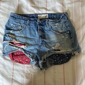 Garage blue shorts with red and blue bandana pockets